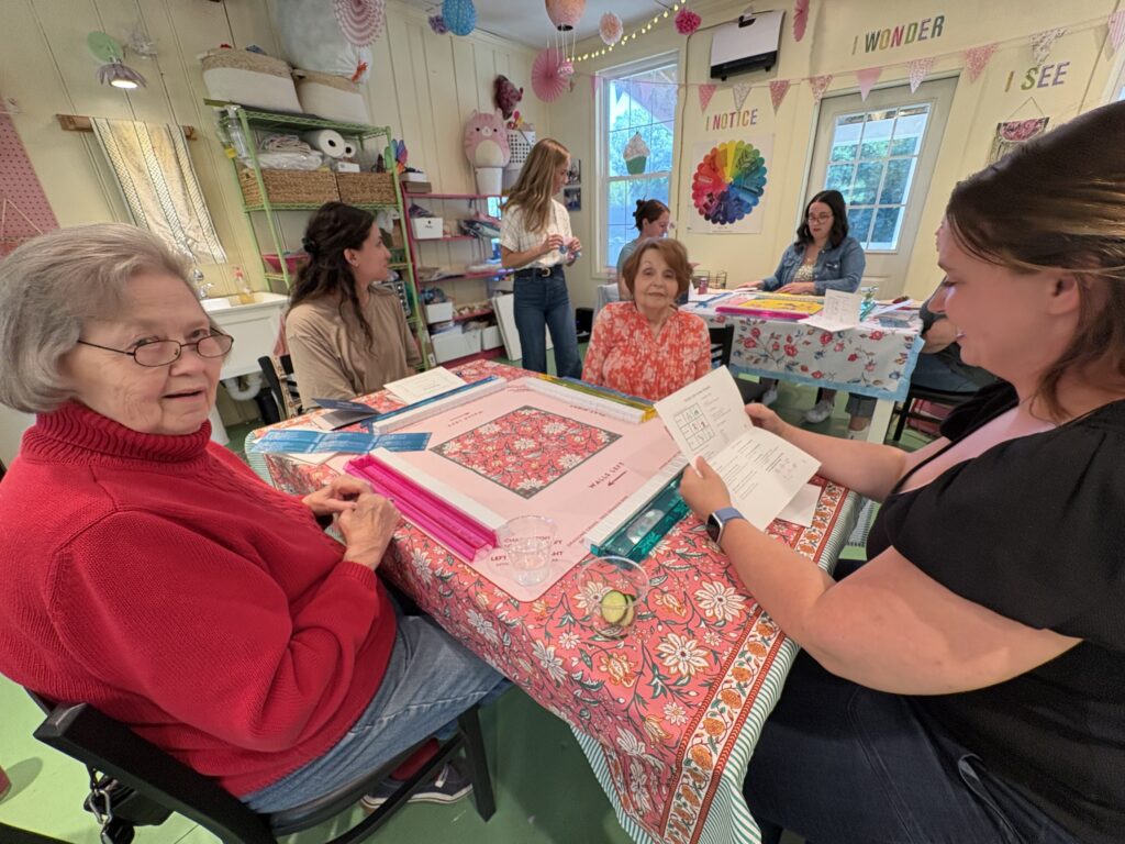Participants practice tile setup and gameplay during a guided beginner American Mahjong lesson at Pink Art Pixie in Joppa, MD. Adults learning American Mahjong during a beginner lesson at Pink Art Pixie in Joppa, Maryland.