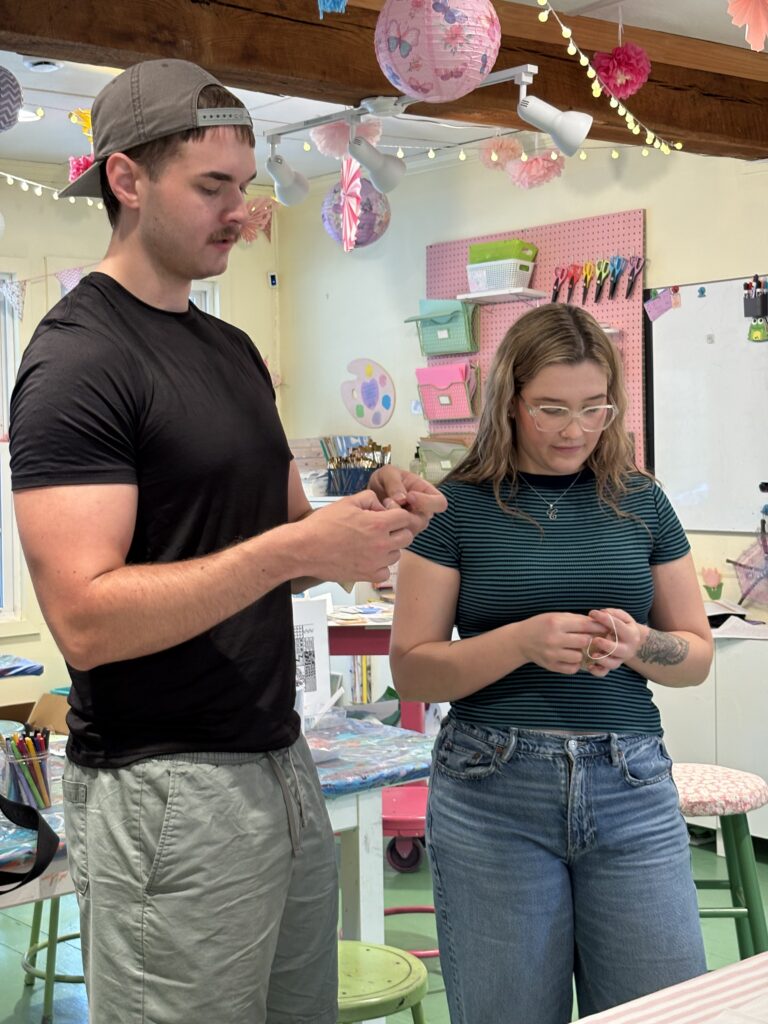 Adults participating in The Art of De-Stressing creative wellness workshop at Pink Art Pixie in Joppa, Maryland. Two adults take part in a guided activity during The Art of De-Stressing, a mindfulness and creative wellness workshop at Pink Art Pixie in Joppa, MD.