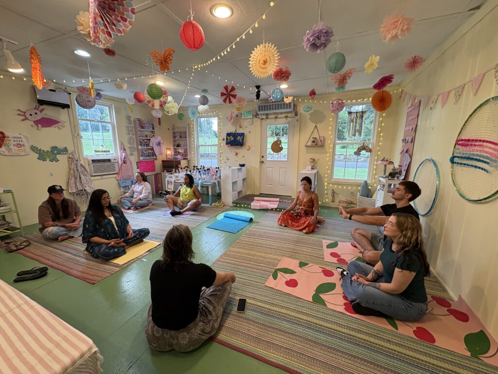 Adults taking part in a guided mindfulness moment during The Art of De-Stressing workshop at Pink Art Pixie in Joppa, Maryland. Participants pause for a calming mindfulness activity during The Art of De-Stressing, an adult creative wellness workshop at Pink Art Pixie in Joppa, MD.
